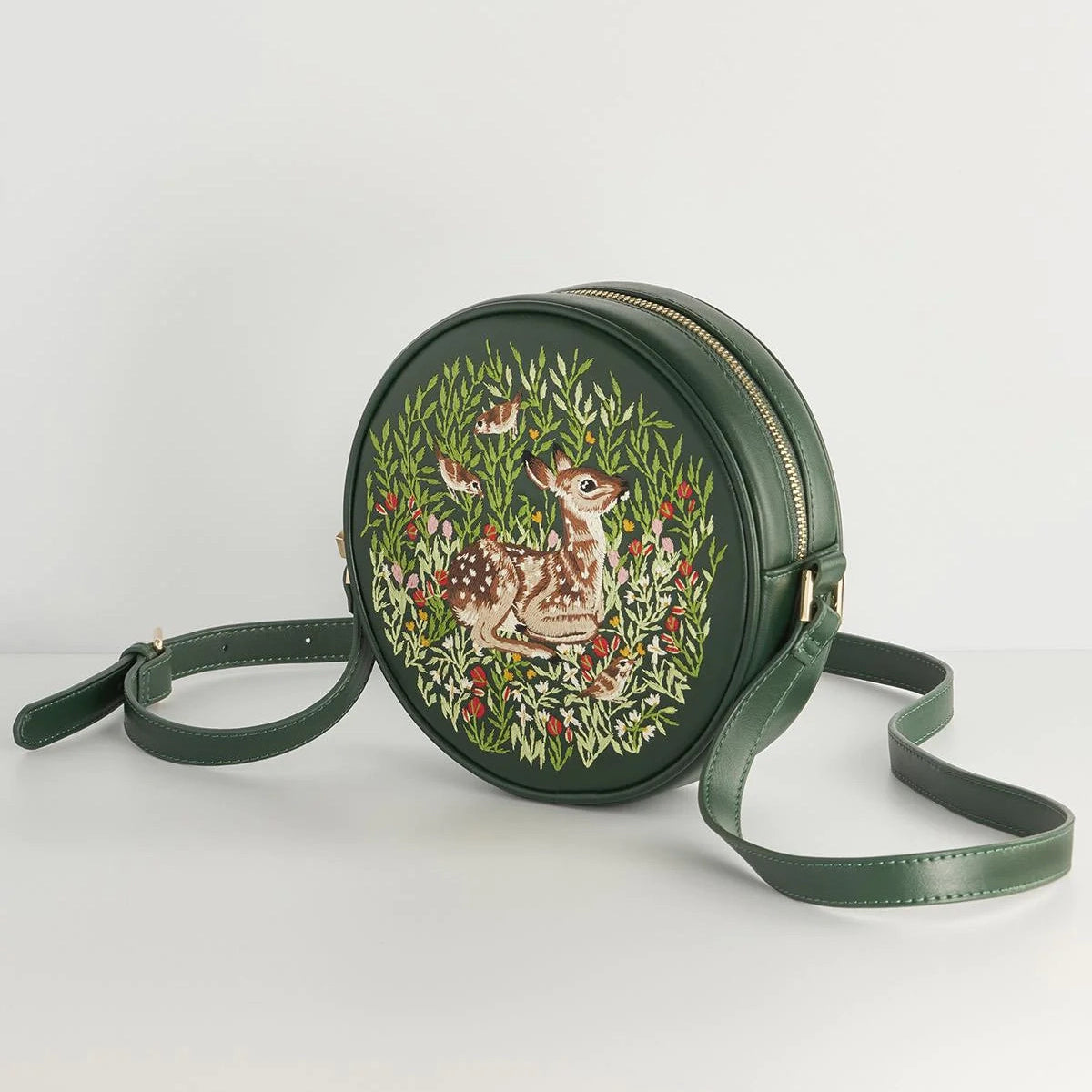 Green round bag with deer design on a white background