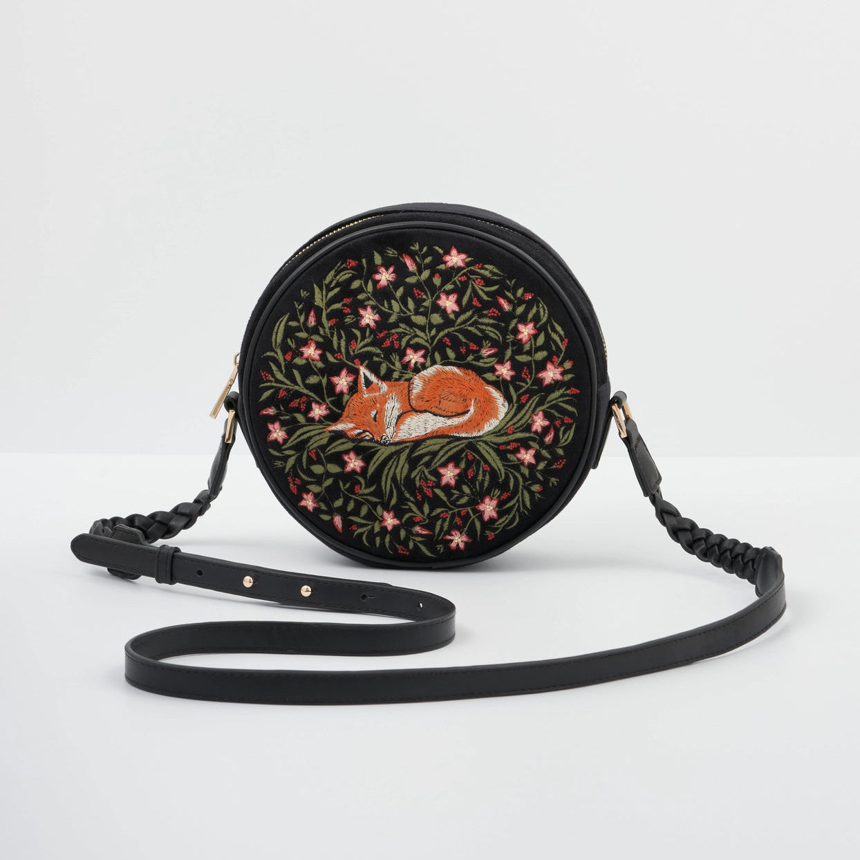 Round embroidered bag with a fox design on a white background