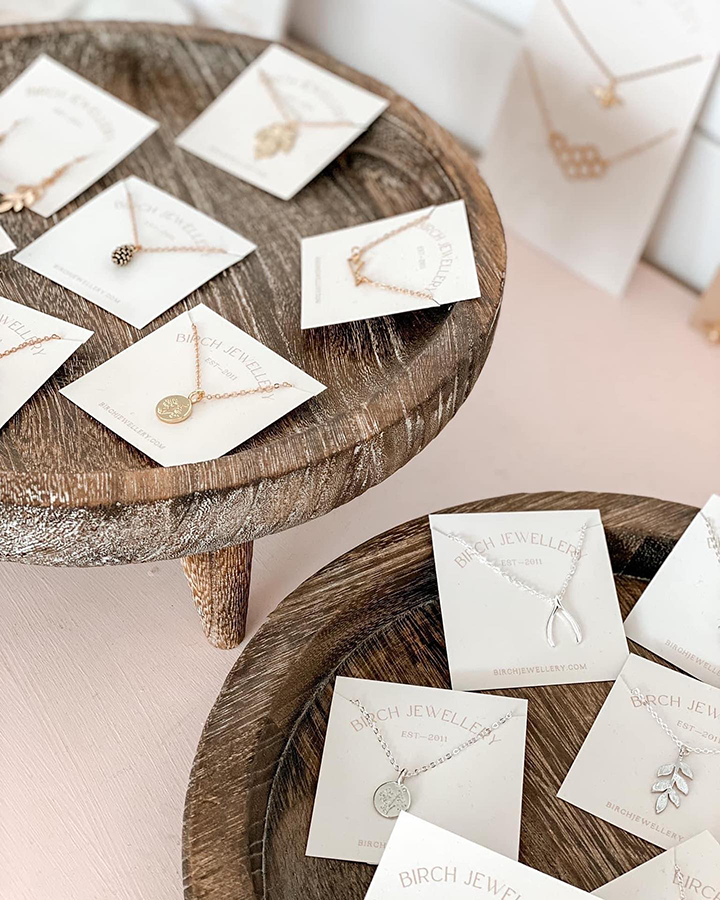 Birch Jewellery necklaces on display cards on a table.